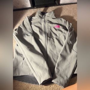 north face grey jacket with pink lettering
